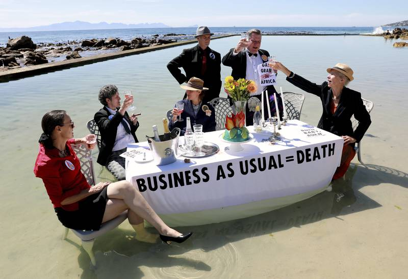 Members of Extinction Rebellion stage a protest at the Glencairn tidal pool outside Cape Town, South Africa to mark the COP27 “Water Day” on 5 November 2022. Photo: AP