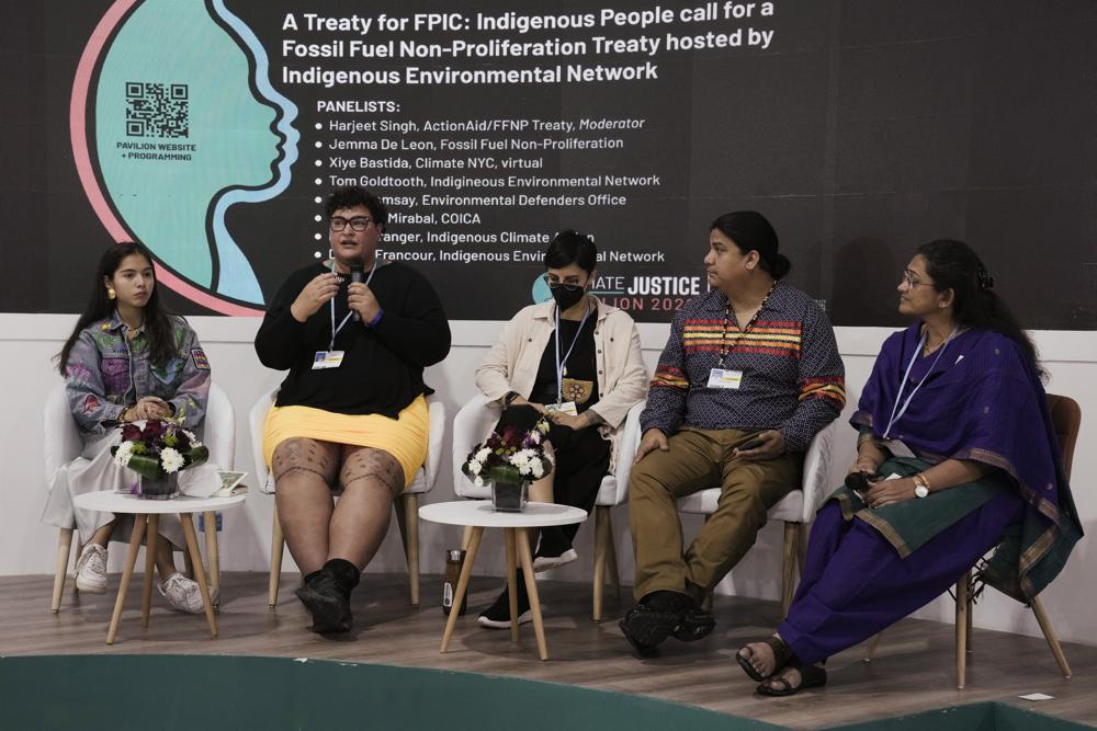 From right, Jyoti Awasthi, moderator, Thomas Joseph, Indigenous Environmental Network, Eriel Deranger, Indigenous rights, gender justice & challenging capitalism and colonialism, Fleur Ramsay, Samoan, Head of Litigation and Climate Lead, Xiye Bastida, of Mexico, participate in a session on fossil fuels at the Indigenous Peoples Pavilion at the COP27 U.N. Climate Summit, Friday, 11 November 2022, in Sharm el-Sheikh, Egypt. Photo: Nariman El-Mofty / AP Photo