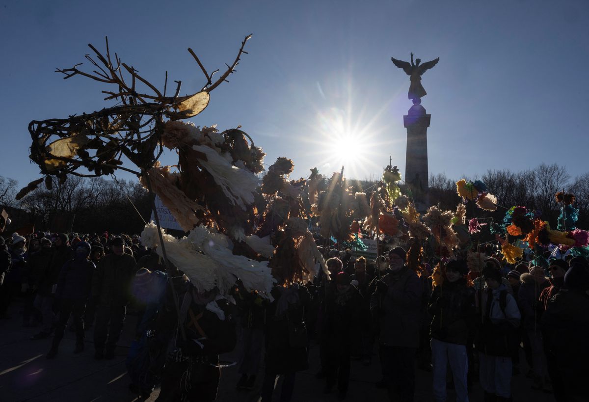 The sun shines on people who were taking part in a protest march during COP15, the two-week U.N. Biodiversity summit in Montreal, Quebec, Canada on 10 December 2022. Photo: Christinne Muschi / REUTERS