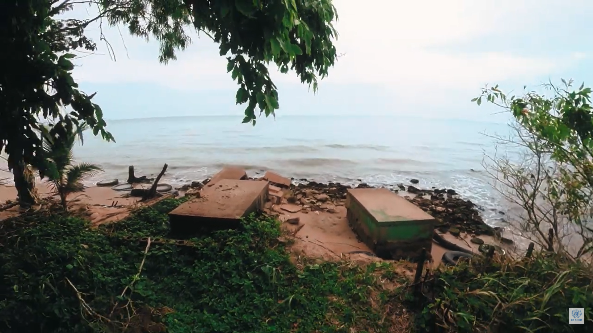 A graveyard that has been washed into the sea due to coastal erosion at Monkey River, a coastal village in south-east Belize. Photo: Andrea Ocampo / UN Video