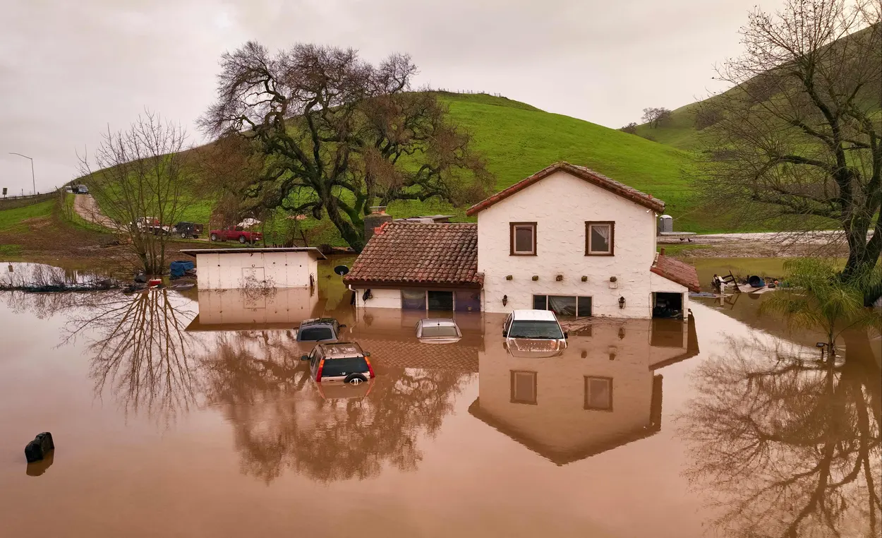 A flooded house is partially underwater in Gilroy, California, on 9 January 2023. Photo: Josh Edelson / AFP / Getty Images