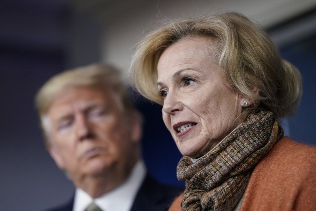Former President Donald Trump looks on as Deborah Birx speaks about the coronavirus outbreak in a press briefing. Photo Drew Angerer / Getty Images