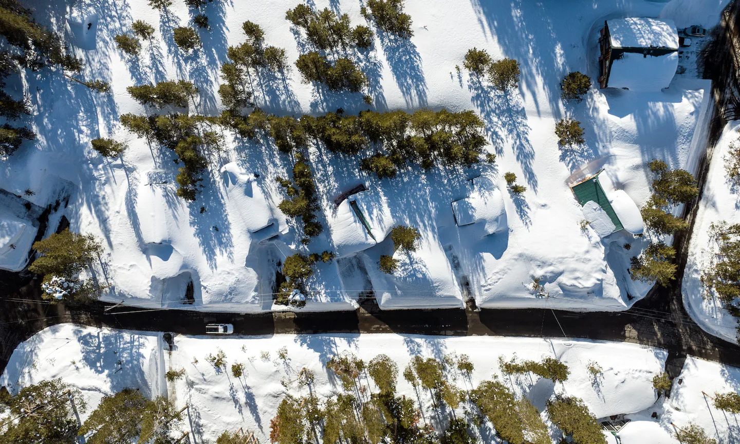 Aerial view of homes buried in snow in Soda Springs, California in March 2023. Photo: Josh Edelson / The Washington Post