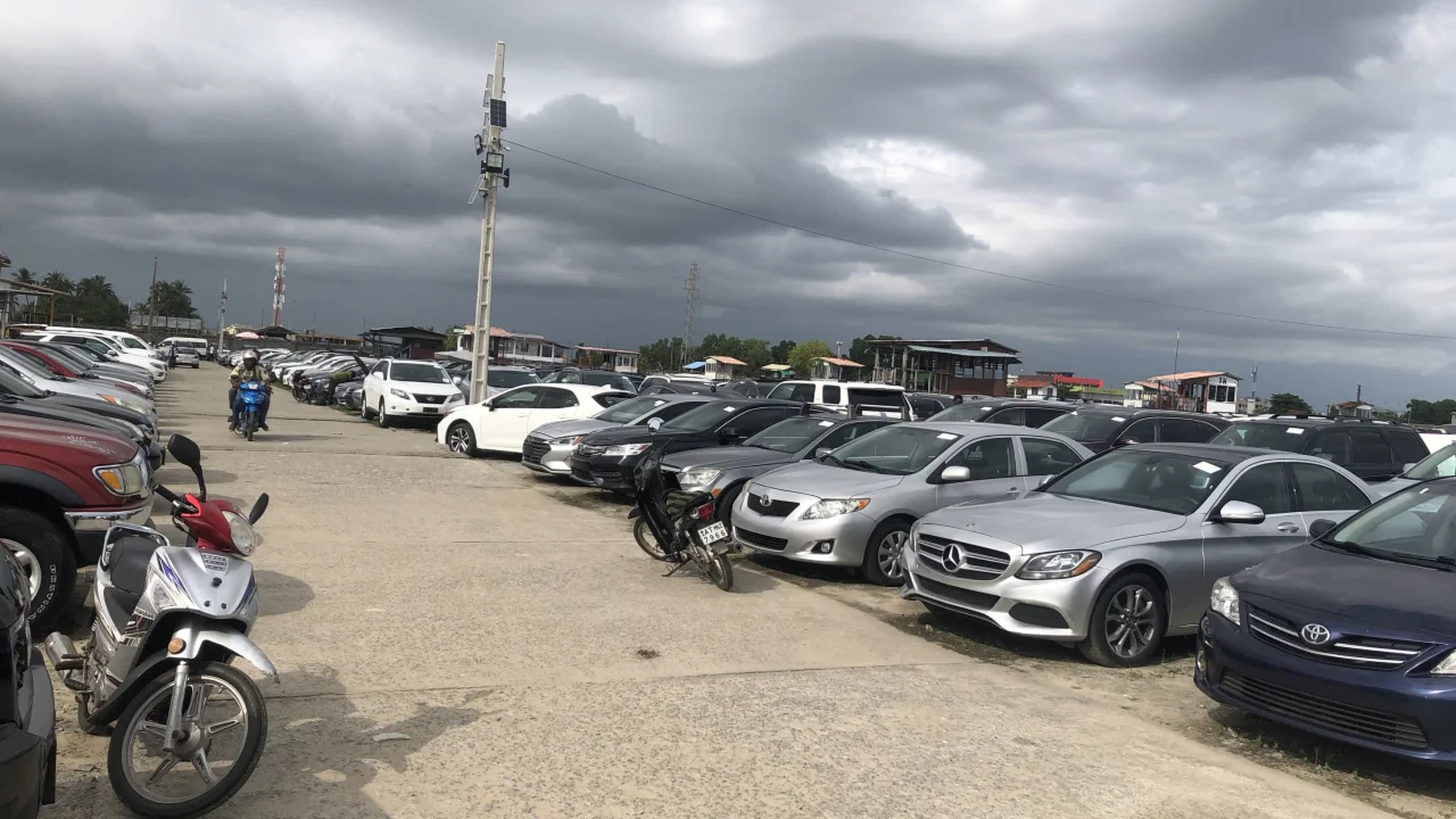 Used cars from wealthy countries such as Japan, South Korea, European countries, and the US are lined up in the Fifa Park car lot in Cotonou, Benin. Photo: Nimi Princewill / CNN