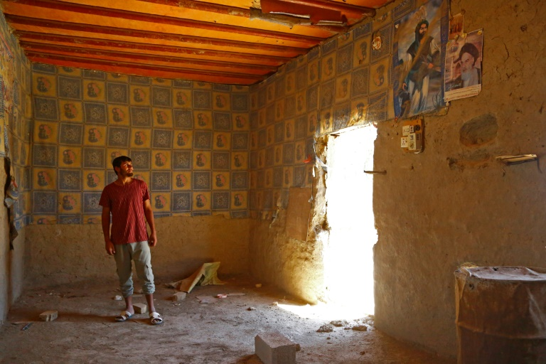 Rooms stripped of their doors and windows show signs of the lives that have been upended by people leaving villages in rural Iraq due to climate change-induced drought. Photo: Hayder INDHAR / AFP