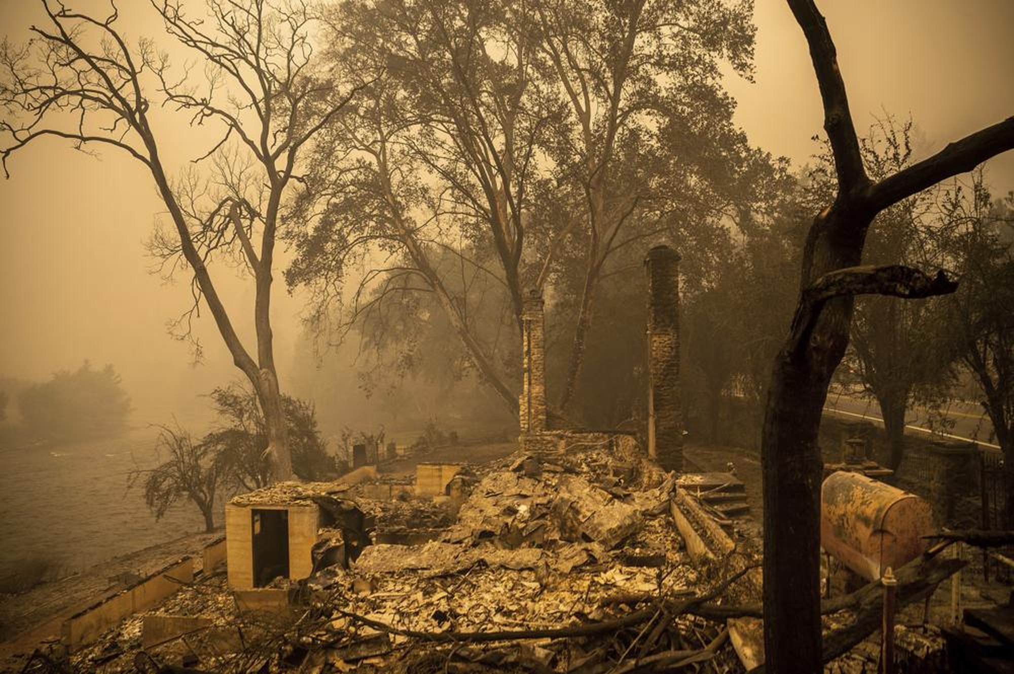 Rubble from a building sits in an area scorched by the McKinney Fire in Klamath National Forest, California, on Sunday, 31 July 2022. Photo: Noah Berger / AP Photo
