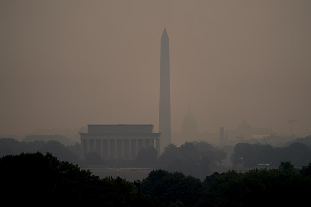 Haze blankets over monuments on the National Mall in Washington, Wednesday, 7 June 2023, as seen from Arlington, Virginia. Smoke from Canadian wildfires poured into the U.S. East Coast and Midwest and covered the capitals of both nations in an unhealthy haze. Photo: Julio Cortez / AP Photo