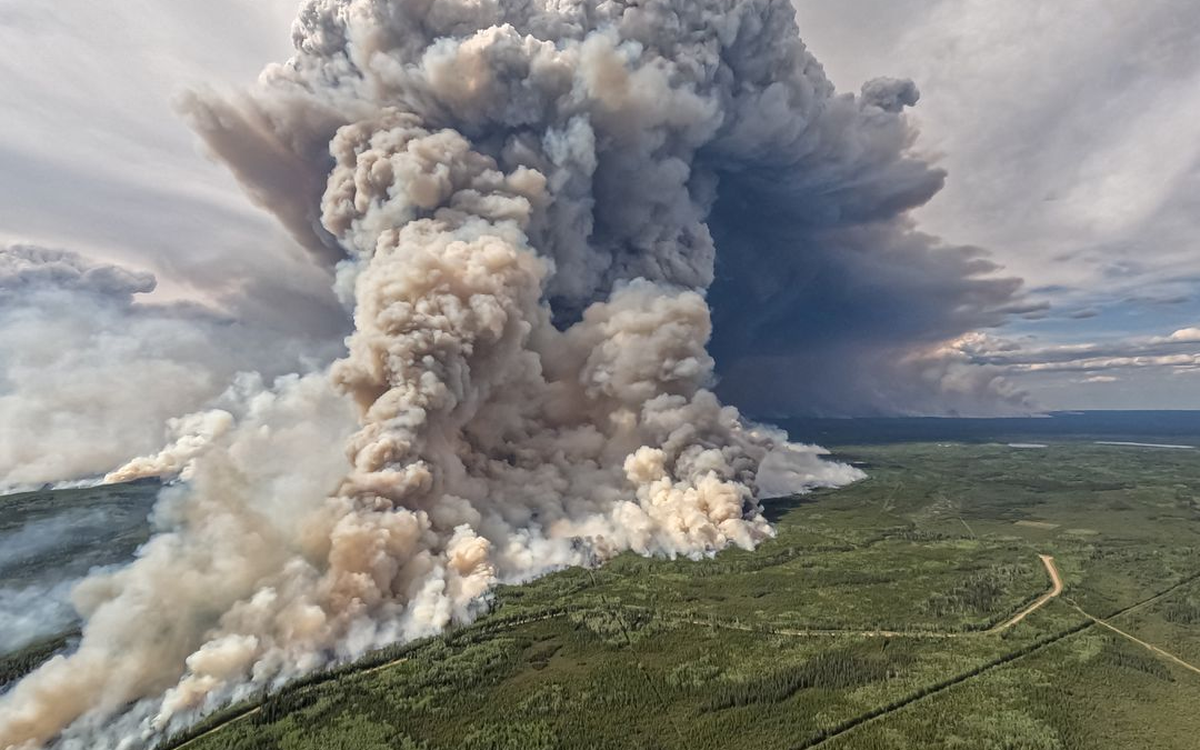 Smoke billows upward from a planned ignition by firefighters tackling the Donnie Creek Complex wildfire south of Fort Nelson, British Columbia, Canada on 3 June 2023. Photo: B.C. Wildfire Service / REUTERS