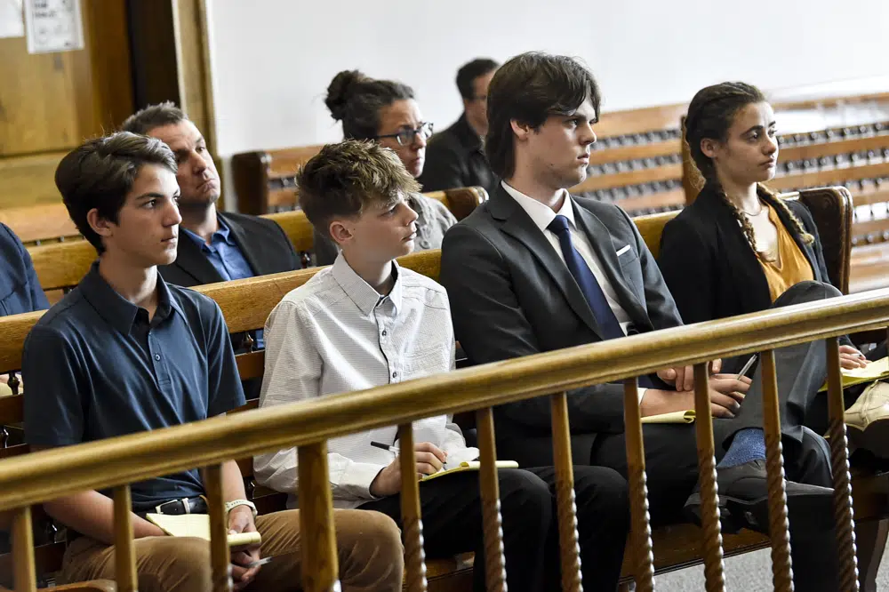 Plaintiffs Mica, 14; Badge 15, Lander 18, and Taleah, 19, listen to arguments during a status hearing on 12 May 2023, in Helena, Montana, for a case that they and other Montana youth filed against the state arguing Montana officials are not meeting their constitutional obligations to protect residents from climate change. The first-of-its-kind trial began Monday, 12 June 2023, before District Court Judge Kathy Seeley in Helena. Photo: Thom Bridge /Independent Record / AP