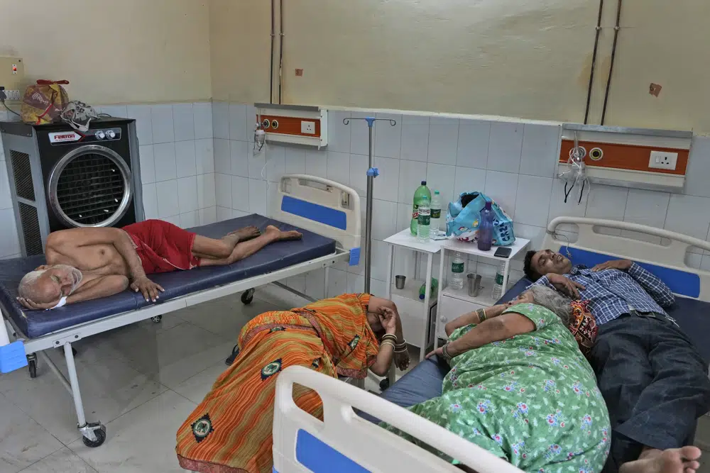 People lie at the overcrowded district hospital in Ballia, Uttar Pradesh state, India, Monday, 19 June 2023. Several people have died in two of India's most populous states in recent days amid a searing heat wave, as hospitals find themselves overwhelmed with patients. More than hundred people in the Uttar Pradesh state, and dozens in neighboring Bihar state have died due to heat-related illness. Photo: Rajesh Kumar Singh / AP Photo