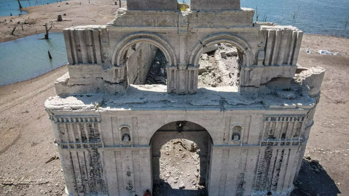 An aerial view shows the normally submerged colonial-era Dominican church in Quechula, Mexico, in June, 2023. The 16th-century construction emerged from reservoir waters amid a drought. Photo: Raul Vera / AFP / Getty Images
