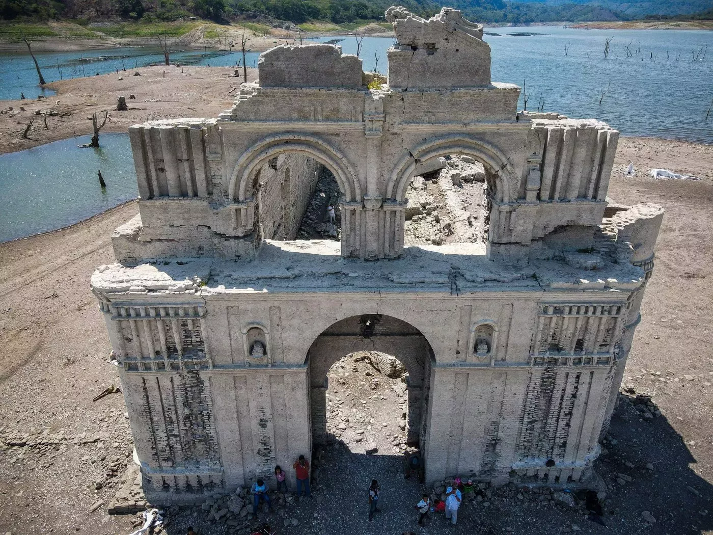 An aerial view shows the normally submerged colonial-era Dominican church in Quechula, Mexico, in June, 2023. The 16th-century construction emerged from reservoir waters amid a drought. Photo: Raul Vera / AFP / Getty Images