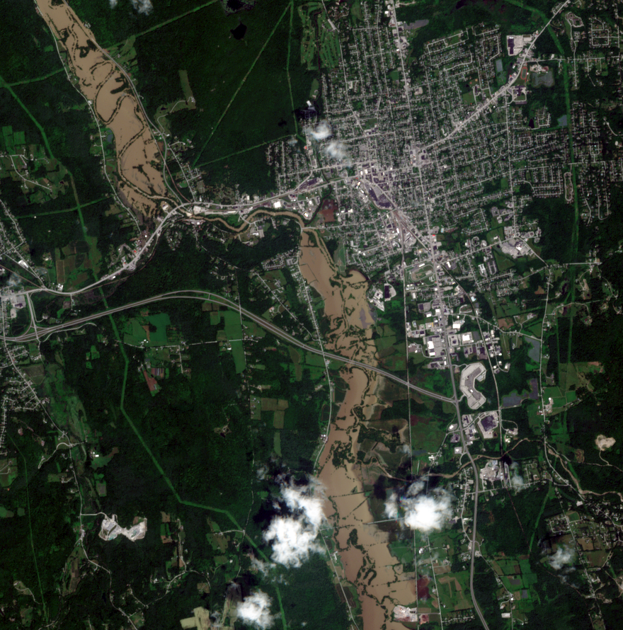 Satellite view of Vermont flooding in July 2023, showing some of the historic damage to roads and infrastructure. In this photo from midday 11 July 2023, the muddy Otter Creek causes extensive flooding by Rutland, VT. The normal channel is a thin line through the floodwaters. Photo: Evan Dethier