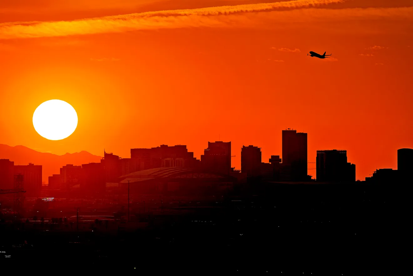 A Jet takes flight over downtown Phoenix on 12 July 2023, when the high hit 111 degrees. Nationwide, more than 113 million Americans were under some form of heat alert, the National Weather Service said. The alerts, which included excessive heat warnings and heat advisories, stretched 2,000 miles from Oregon to Louisiana. Photo: Matt York / AP