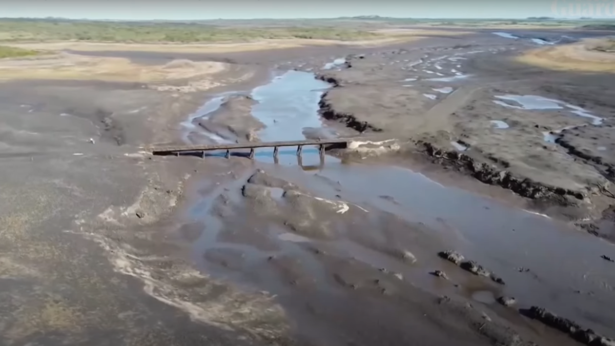 Aerial view of the Paso Severino reservoir that supplies water to Montevideo, Uruguay, in July 2023. It is nearly completely empty and currently only holds only 3 percent of its normal capacity due to three consecutive years of drought. Uruguay is facing the worst water crisis in its history due to the prolonged drought. Photo: Guardian News