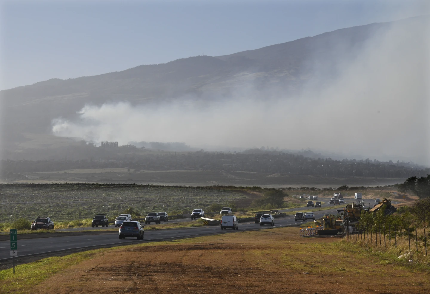 Smoke blows across the slope of Haleakala volcano on Maui, Hawaii, as a fire burns in Maui’s upcountry region on Tuesday, 8 August 2023. Several Hawaii communities were forced to evacuate from wildfires that destroyed at least two homes as of Tuesday as a dry season mixed with strong wind gusts made for dangerous fire conditions. Photo: Matthew Thayer / The Maui News / AP