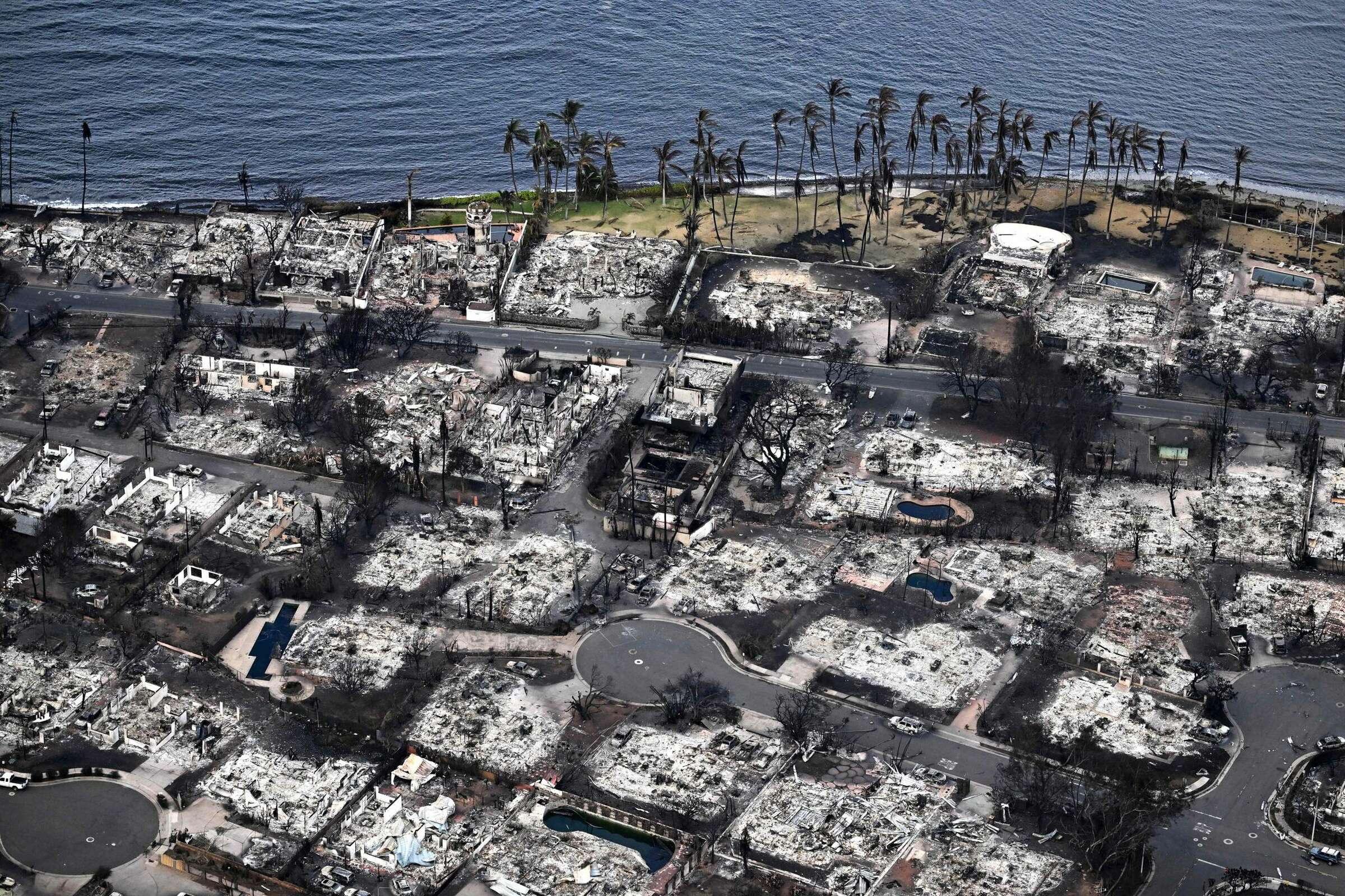 An aerial image taken on Tuesday, 8 August 2023, shows incinerated homes and buildings In Lahaina in the aftermath of wildfires in western Maui. Photo: Patrick T. Fallon / AFP / Getty Images
