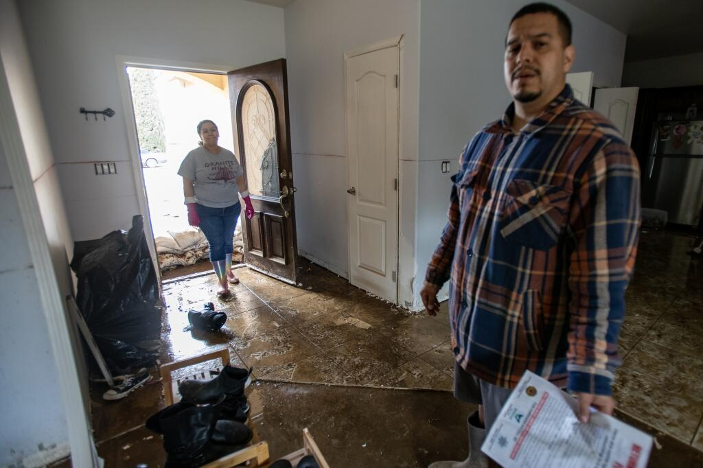 Joshua and Amada Diaz removed wet wallboard as well as soaked belongings after their Woodlake, California, home flooded in March 2023. The floods came as powerful atmospheric rivers hammered the state. Photo: Gina Ferazzi / Los Angeles Times
