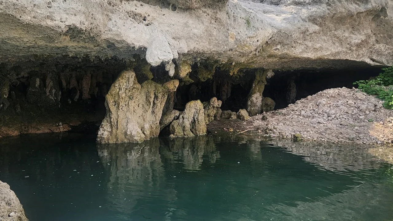 This cave, which is typically underwater at Canyon Lake, appeared as Texas has suffered extreme heat and little rain over the summer of 2023. Photo: JM Perez / CNN