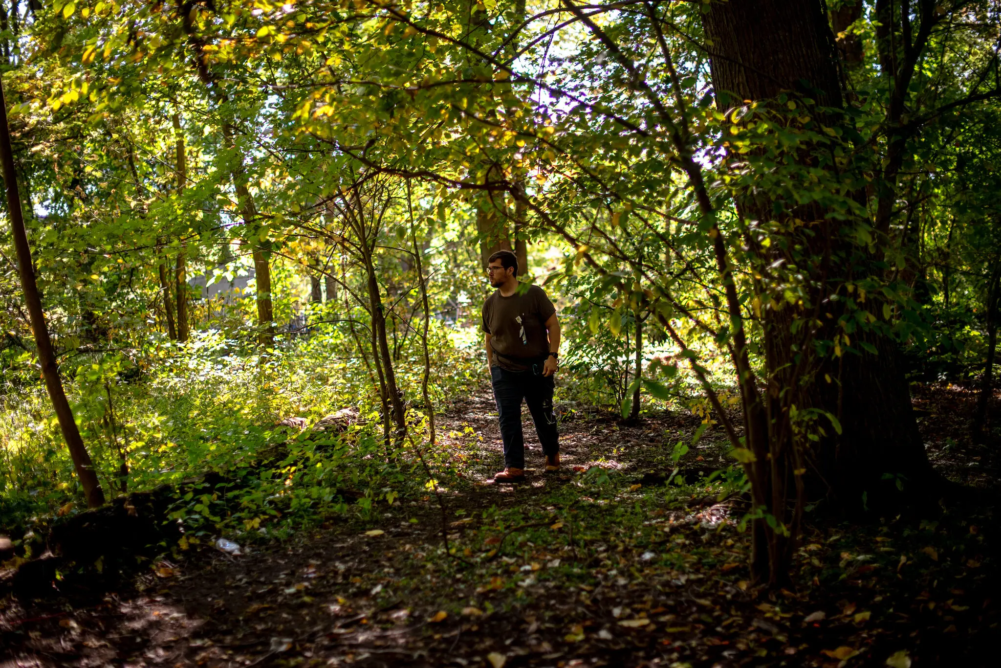 Dr. Nic Helmstetter, who makes weekly primary care rounds with Street Medicine Kalamazoo, brings addiction treatment supplies to patients living in the woods. Photo: Hilary Swift / The New York Times