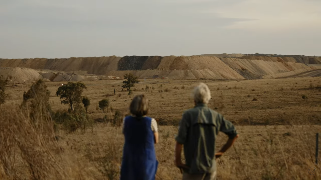 Wendy Wales and Tony Lonergan of the local community organisation Denman Aberdeen Muswellbrook Scone Healthy Environment Group (DAMSHEG) view tailings from the Mount Pleasant Coal Mine in New South Wales, Australia. Photo: Environmental Defenders Office