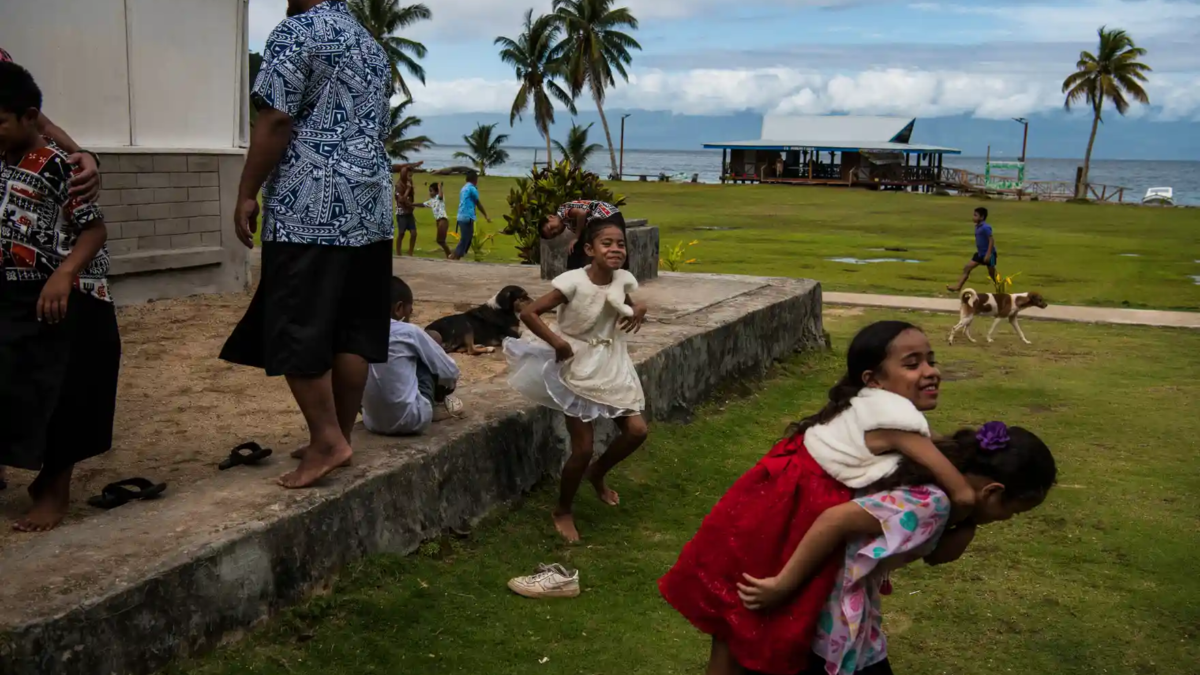 Churchgoers leave Sunday morning service in Kioa, Fiji. Photo: Andrew Quilty / The Guardian