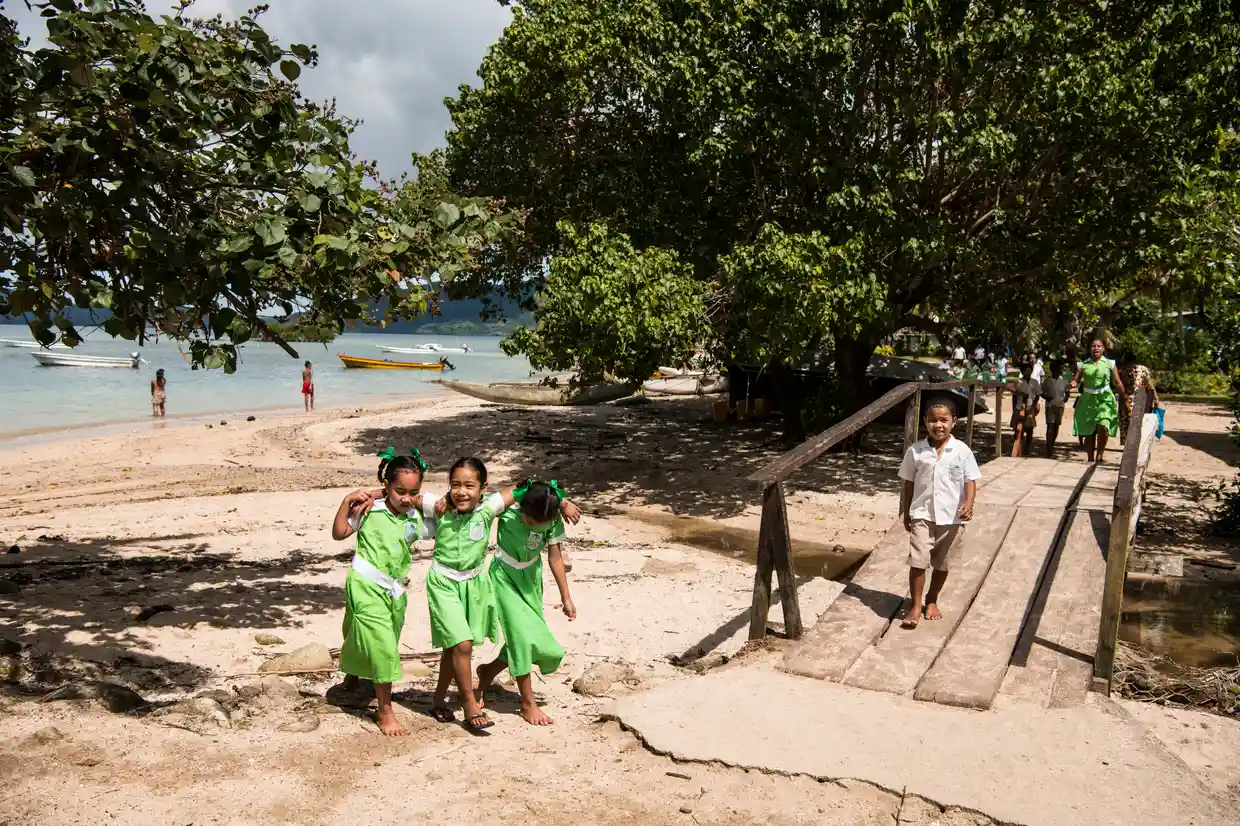 Children leave school for lunch break on Kioa, Fiji. Photo: Andrew Quilty / The Guardian