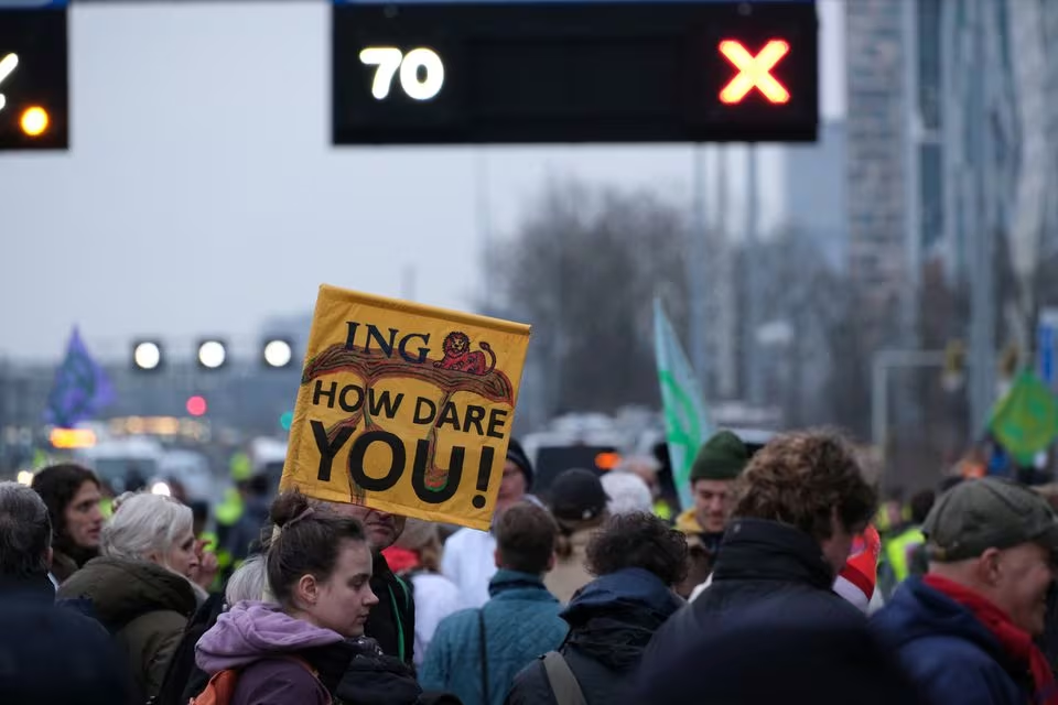 Climate activists from Extinction Rebellion Netherlands protest against ING on a highway in Amsterdam, Netherlands on 30 December 2023 in this picture obtained from social media. Photo: Extinction Rebellion Netherlands / REUTERS