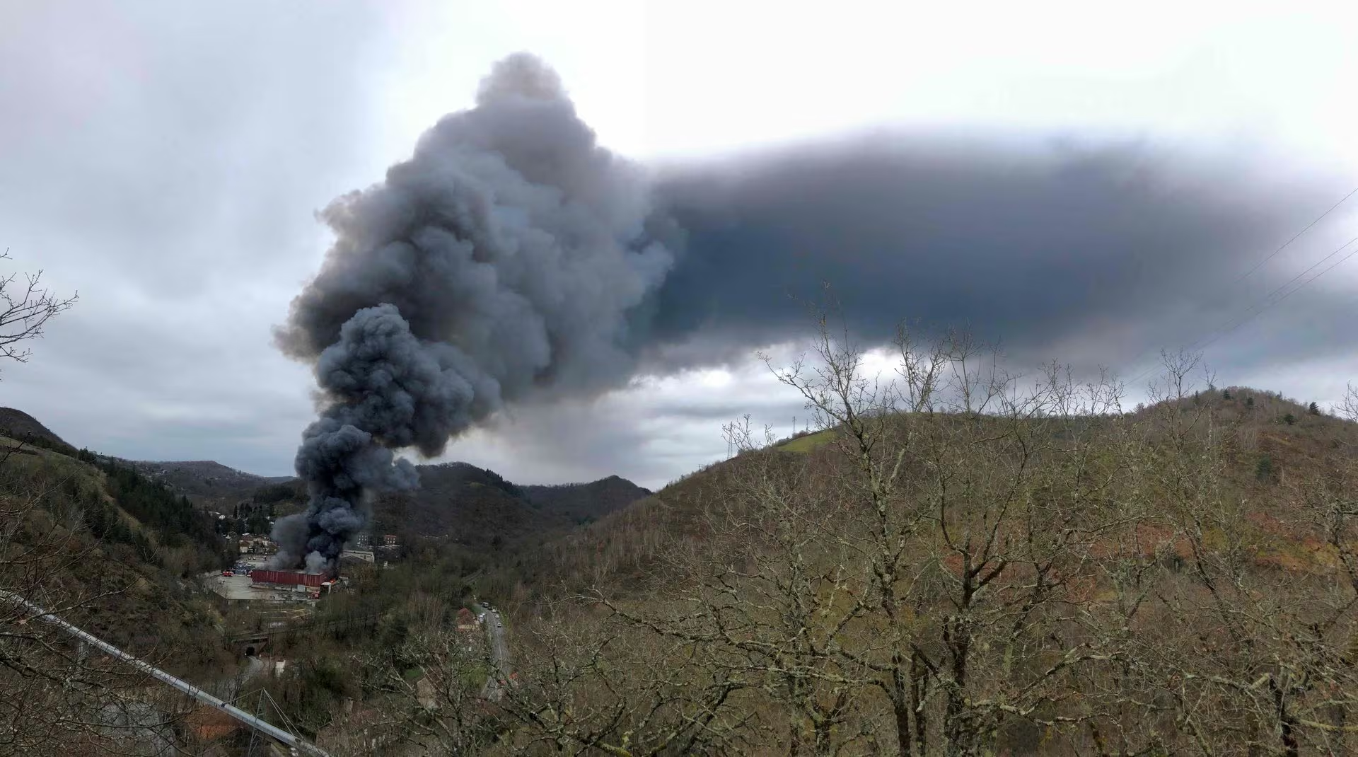 Smoke rises from a warehouse fire, owned by French recycling group SNAM, which houses lithium batteries in Viviez, north of Toulouse, France, 17 February 2024 in this image obtained from social media. Photo: Adeba / REUTERS