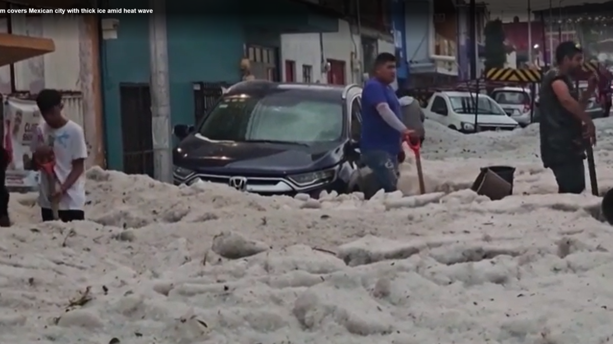 Residents shovel thick layers of ice after a surprise hailstorm hit Puebla, Mexico on 24 May 2024. Photo: Reuters