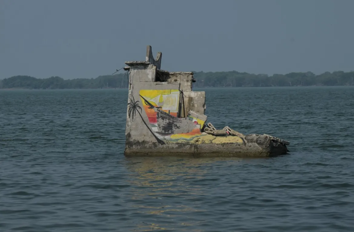 The walls and cisterns of some of the homes stand out as evidence that there used to be a fishing village here in the community of El Bosque in Nuevo Centla, Tabasco state, Mexico, before it was swallowed by the rising sea. Photo: Yuri Cortez / AFP