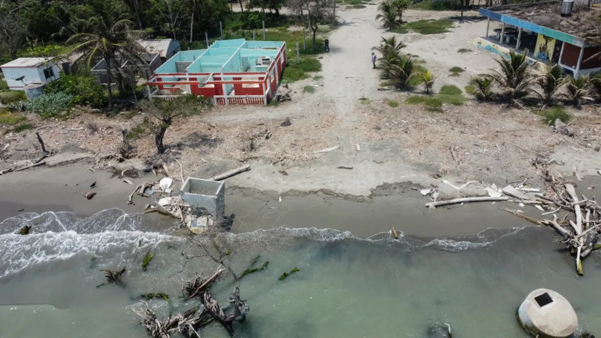 Aerial view showing houses destroyed by rising sea levels and coastal erosion associated with climate change, in the community of El Bosque in Nuevo Centla, Tabasco state, Mexico. Photo: Yuri Cortez / AFP