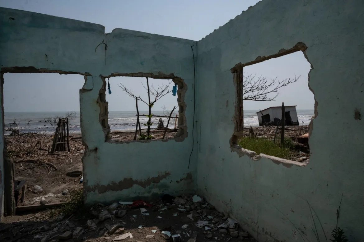 The walls and cisterns of some of the homes stand out as evidence that there used to be a fishing village here in the community of El Bosque in Nuevo Centla, Tabasco state, Mexico, before it was swallowed by the rising sea. Photo: Yuri Cortez / AFP