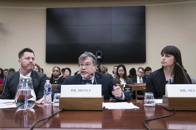 Researchers Peter Hotez (centre) and Tara Kirk Sell (right) at a congressional hearing in 2020. Photo: Sarah Silbiger / Bloomberg / Getty