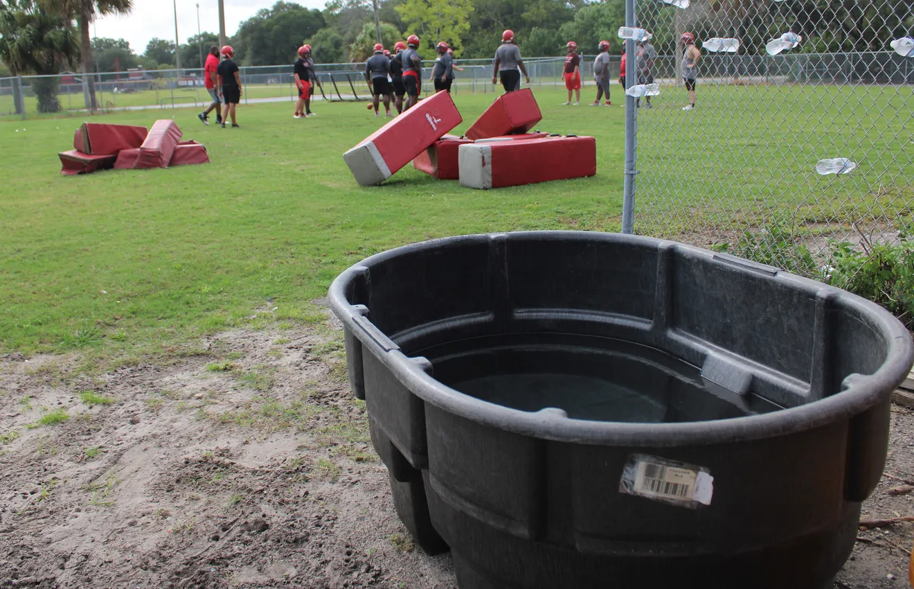 A cold-water immersion tub sits next to the football practice field at Terry Parker High School in Jacksonville, Florida on 24 August 2020. Under the Zachary Martin Act, passed earlier in 2020, schools must provide cooling zones for athletic activities to reduce the risk of heat illness. Photo: Clayton Freeman / Florida Times-Union