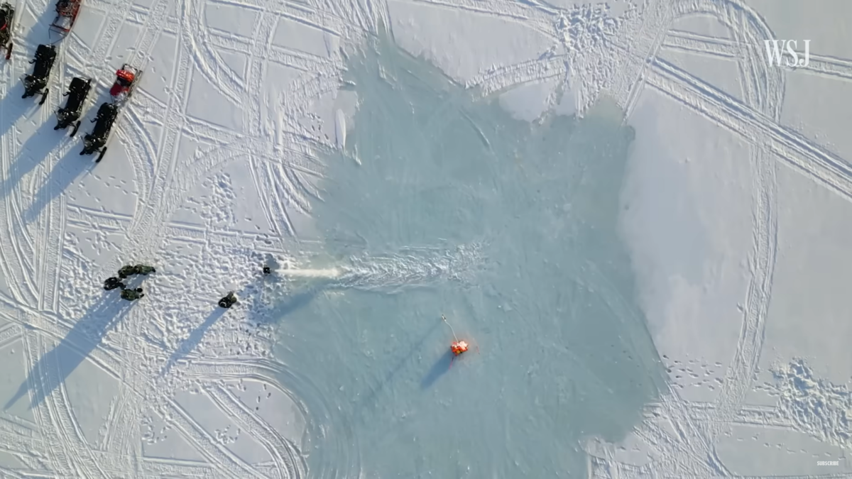 Aerial view of researchers for the Dutch startup company, Arctic Reflections, as they pump 900 gallons per minute of water for hours at a time to create a layer of ice on the Arctic sea ice. Photo: The Wall Street Journal