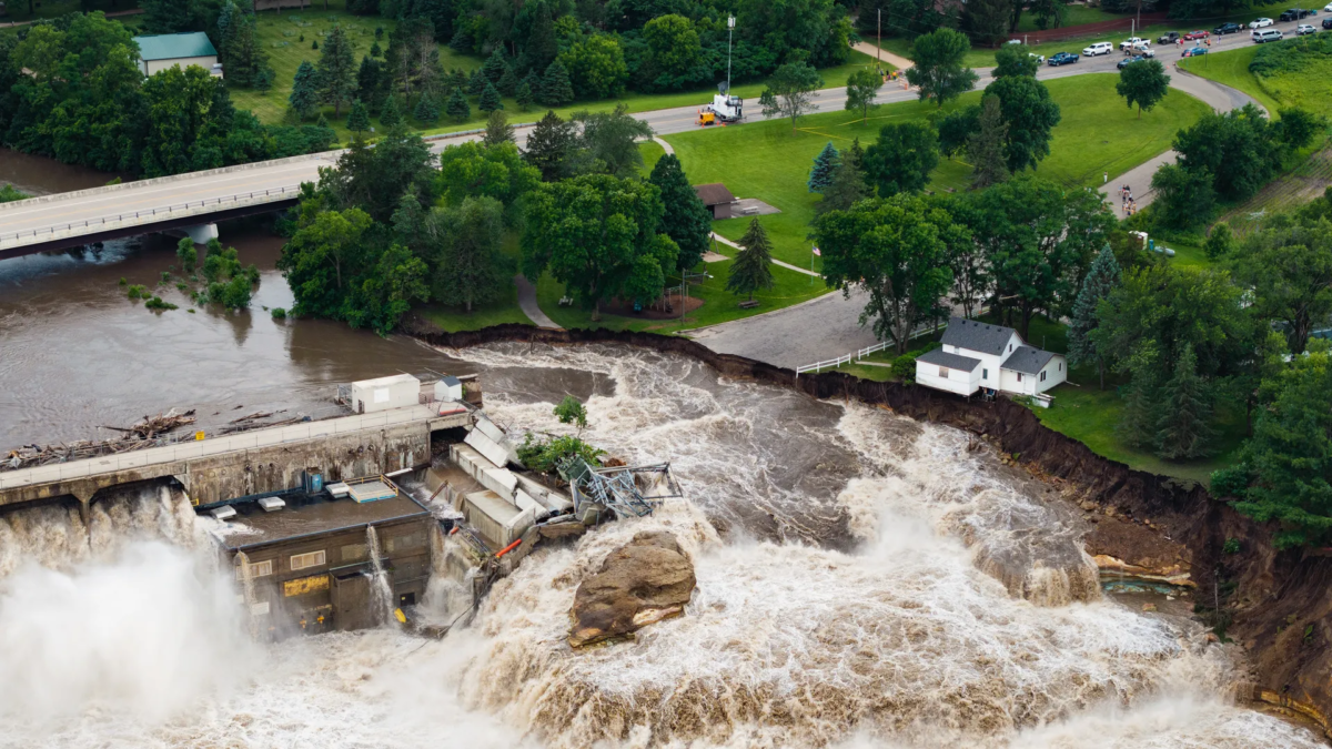 Floodwaters rushed around the Rapidan Dam on the Blue Earth River in Minnesota on 24 June 2024, washing away an electrical substation. Photo: Ben Brewer / Bloomberg / Getty Images