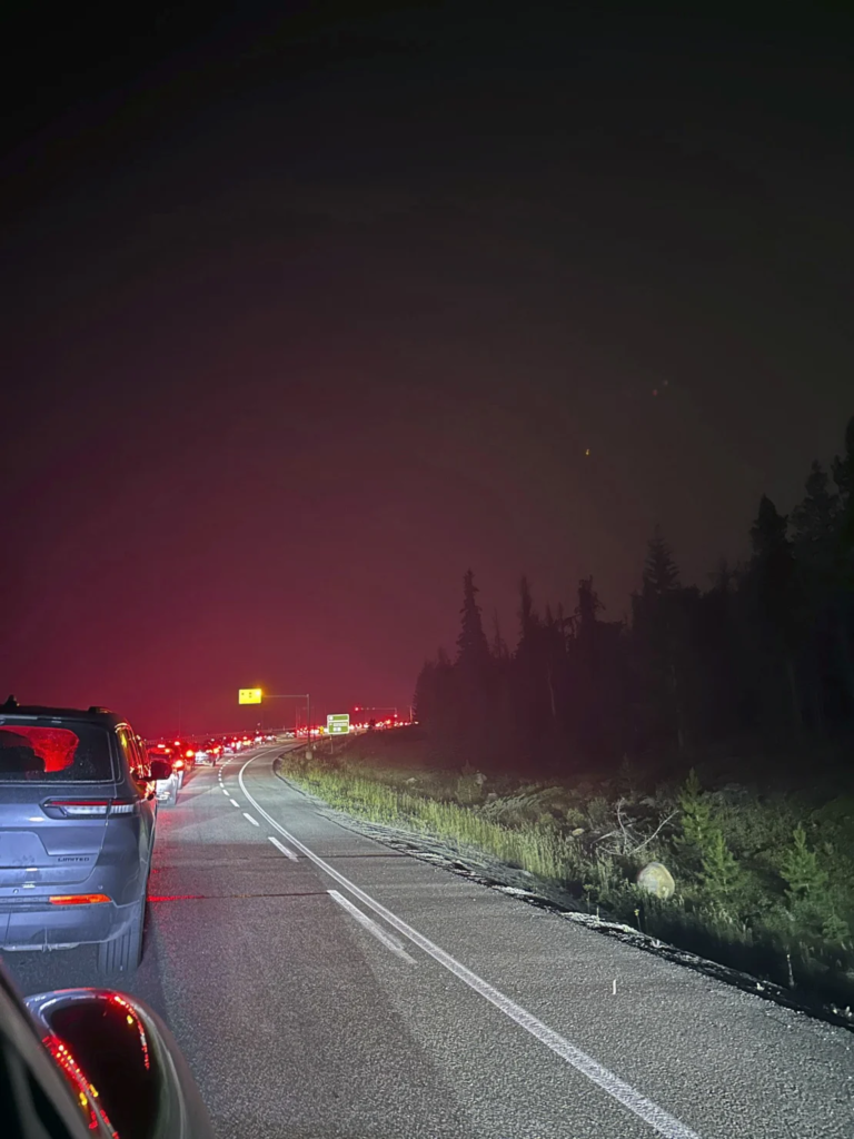 Cars clog the highway as people evacuate because of wildfires early Tuesday, 23 July 2024 in Jasper, Alberta. Photo: Carolyn Campbell / The Canadian Press / AP