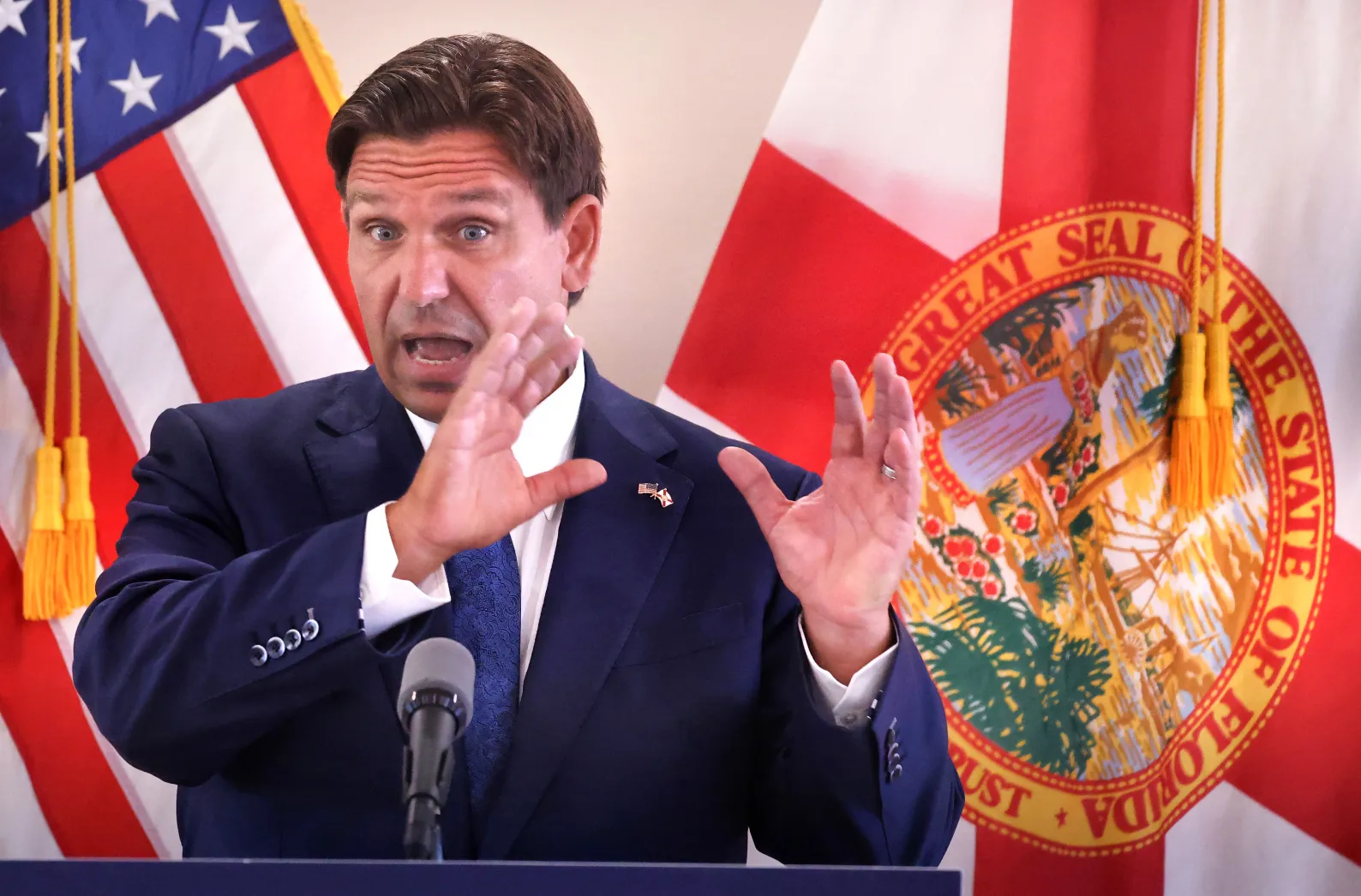 Florida governor Ron DeSantis delivers remarks in Umatilla, Florida,Tuesday, 25 June 2024, during a visit to tout the state’s infrastructure grants program. In May 2024, DeSantis signed a bill that stripped the phrase “climate change” from much of Florida law, reversing 16 years of state policy and, critics said, undermining Florida’s support of renewable and clean energy. Photo: Joe Burbank / Orlando Sentinel