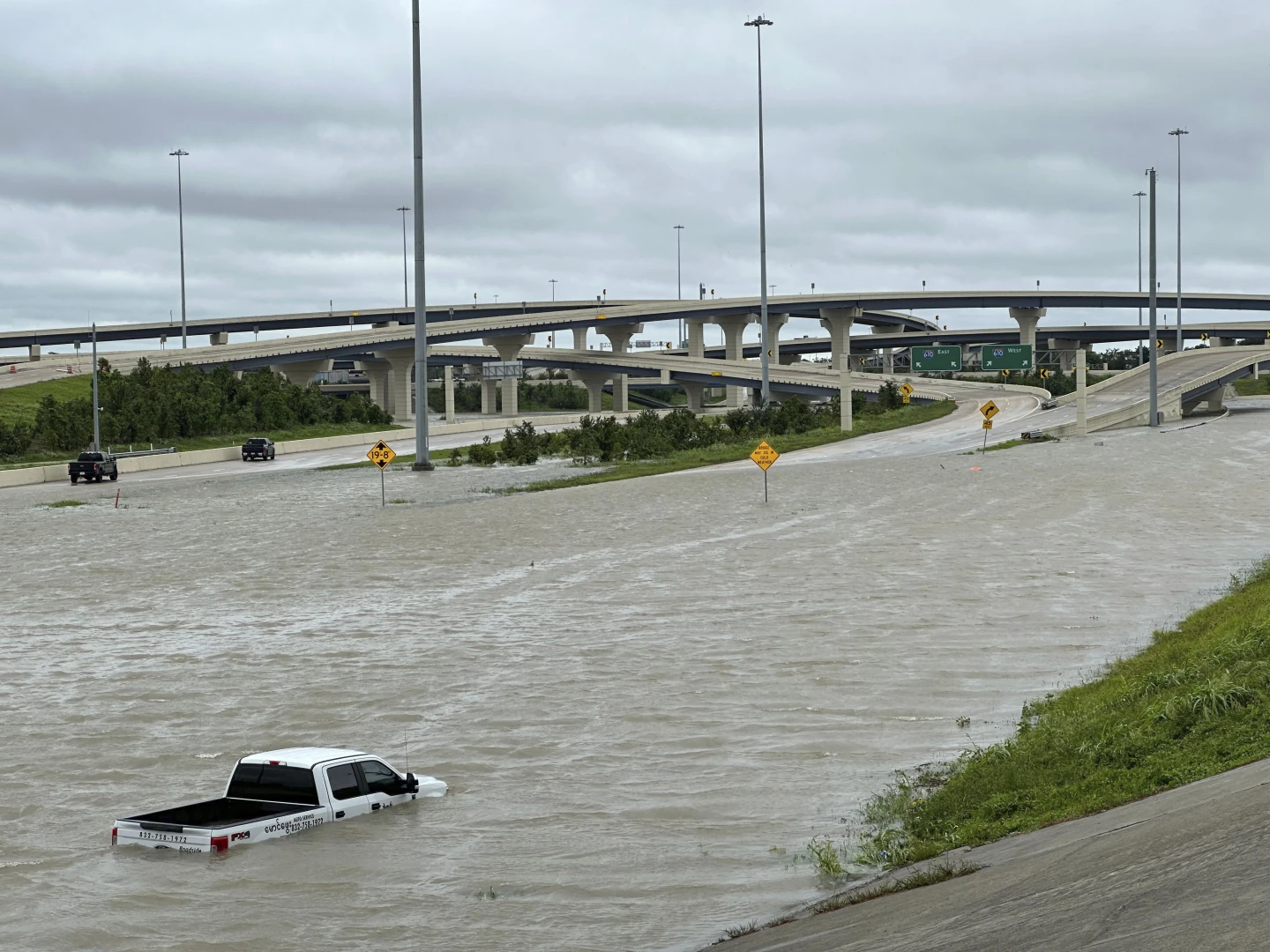 A vehicle is stranded in high waters on a flooded highway in Houston, on Monday, 8 July 2024, after Hurricane Beryl came ashore in Texas and dumped heavy rains along the coast. Photo: Juan A. Lozano / AP Photo