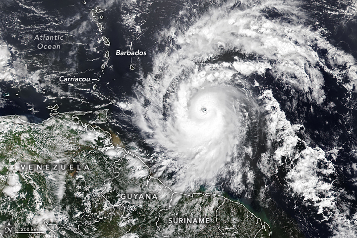 Satellite view of Hurricane Beryl, 30 June 2024. The first Atlantic hurricane of 2024 produced dangerous winds and life-threatening storm surge as it barreled into the Caribbean’s Grenadine Islands. On the morning of 1 July 2024, Hurricane Beryl made landfall on Carriacou Island as a Category 4 storm with maximum sustained winds of 150 miles (240 kilometers) per hour. This image, captured by the VIIRS (Visible Infrared Imaging Radiometer Suite) on NOAA-21, shows Hurricane Beryl at 12:50 p.m. Atlantic Standard Time on 30 June 2024, when the eye of the storm was about 300 miles (490 kilometers) southeast of Barbados. An hour before the image was captured, the National Hurricane Center upgraded Beryl to a Category 4 hurricane with sustained winds of 130 miles per hour. Photo: Michala Garrison / NASA Earth Observatory