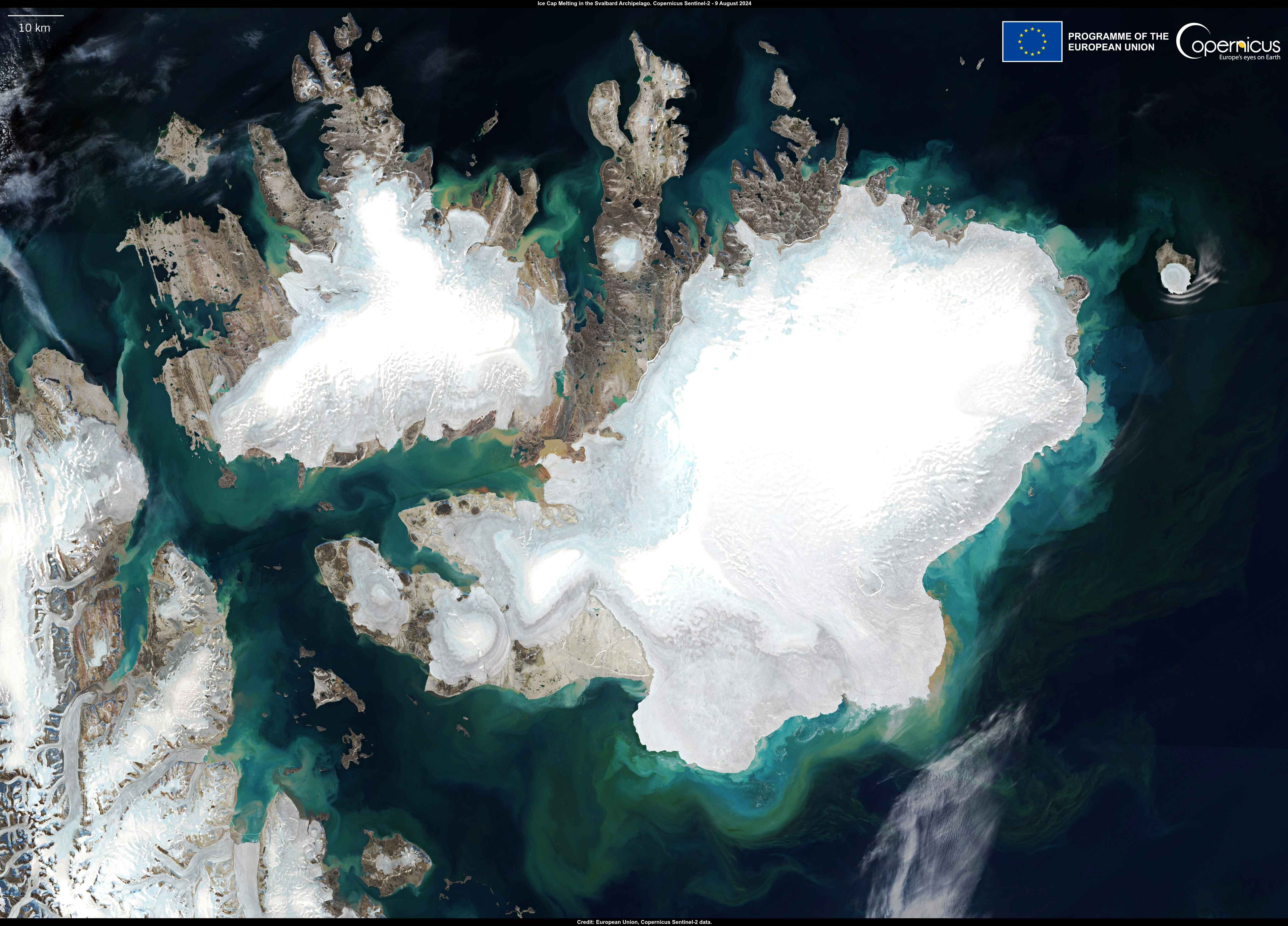 Satellite image of record ice cap melting in the Svalbard Archipelago. This image, acquired by one of the Copernicus Sentinel-2 satellites on 9 August, shows a large discharge of water and sediment in the Arctic Ocean, off the coast of Nordaustlandet (the second largest island in the archipelago), caused by the rapid melting of snow and ice. According to the Laboratory of Climatology and Topoclimatology at the University of Liège, in early August, snow and ice melting on the surface of the Svalbard ice caps reached the highest levels ever recorded, while temperatures remained up to 5°C above average for this area of the Arctic Circle. Photo: European Union /  Copernicus Sentinel-2 imagery