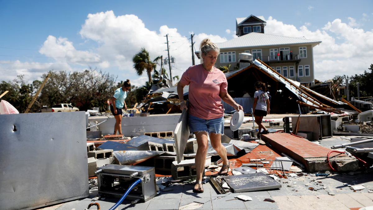 Nikki Wicker, co-owner of Roy's Restaurant, cleans after Hurricane Helene made landfall overnight, in Steinhatchee, Florida, 27 September 2024. Photo: Octavio Jones / REUTERS