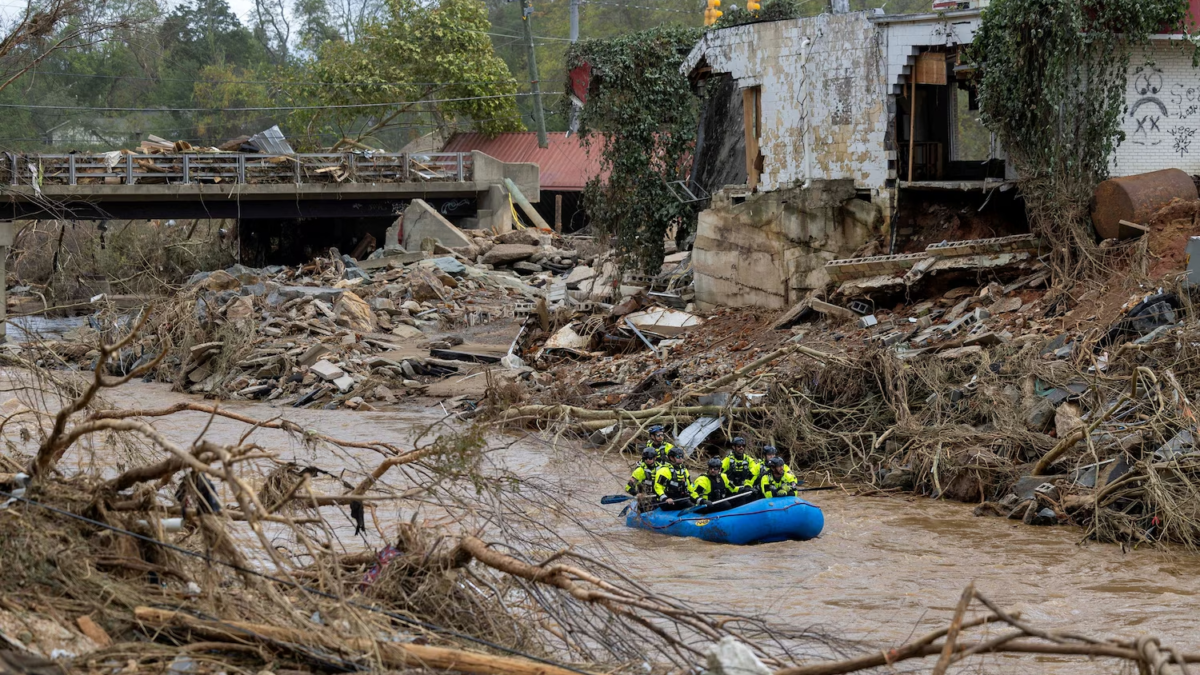 A rescue team paddles down the Swannanoa River after the remnants of Hurricane Helene caused widespread flooding, downed trees, and power outages in western North Carolina, 29 September 2024. Photo: Travis Long / The News and Observer / Reuters