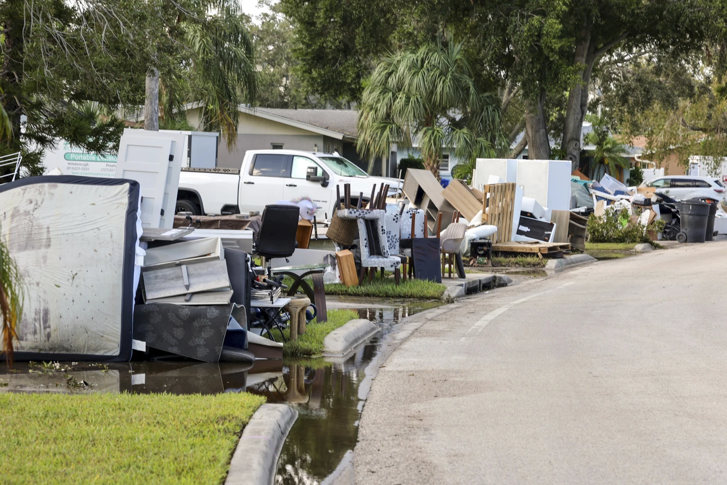 Residents discard items from their homes which filled with floodwaters from Hurricane Helene in the Shore Acres neighborhood on Saturday, 28 September 2024, in St. Petersburg, Florida. Photo: Mike Carlson / AP Photo