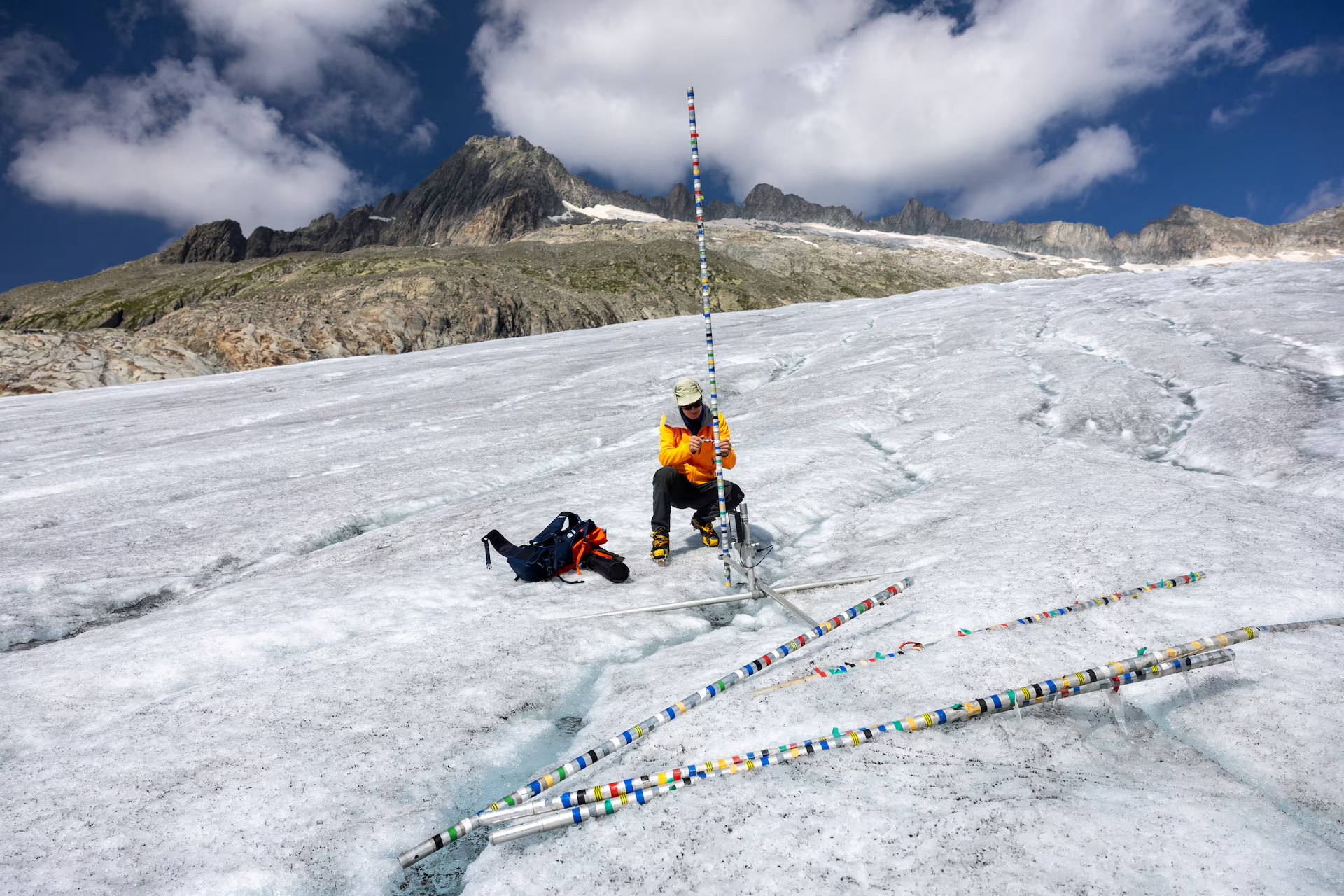 Glaciologist at ETH Zurich and Head of the Glacier Monitoring in Switzerland (GLAMOS) Matthias Huss check his equipment on the Rhone glacier amid climate change in Obergoms, Switzerland, 27 August 2024. Photo: Denis Balibouse / REUTERS